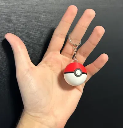 Imagem de referência do modelo 3D Chaveiro Pokébola; foto ilustrativa, cores finais azul ou azul com verde.